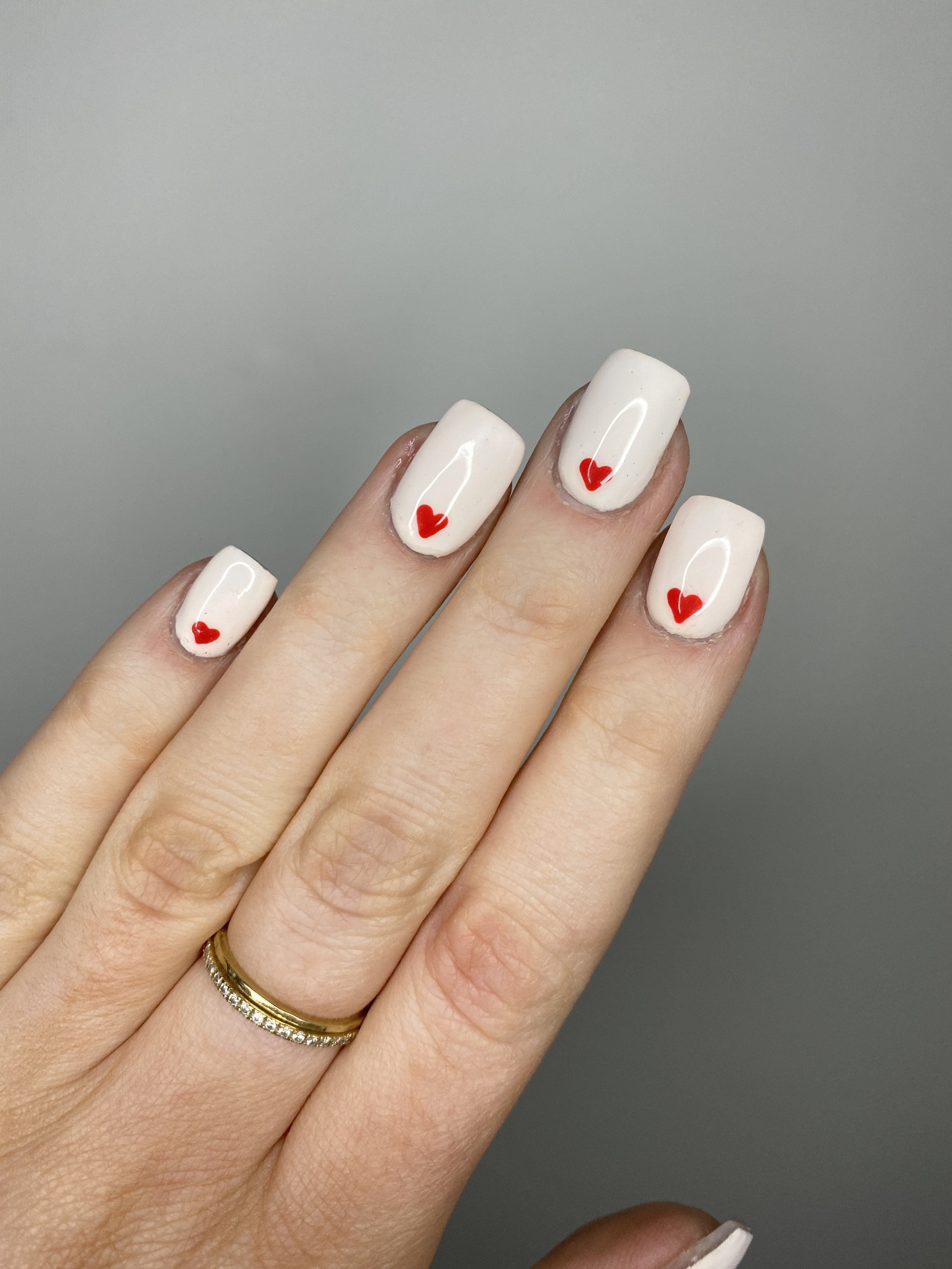 Acrylic nails with red hearts
